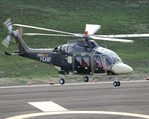 A prototype of the AgustaWestland AW169 lifts-off from a helipad during its maiden flight.